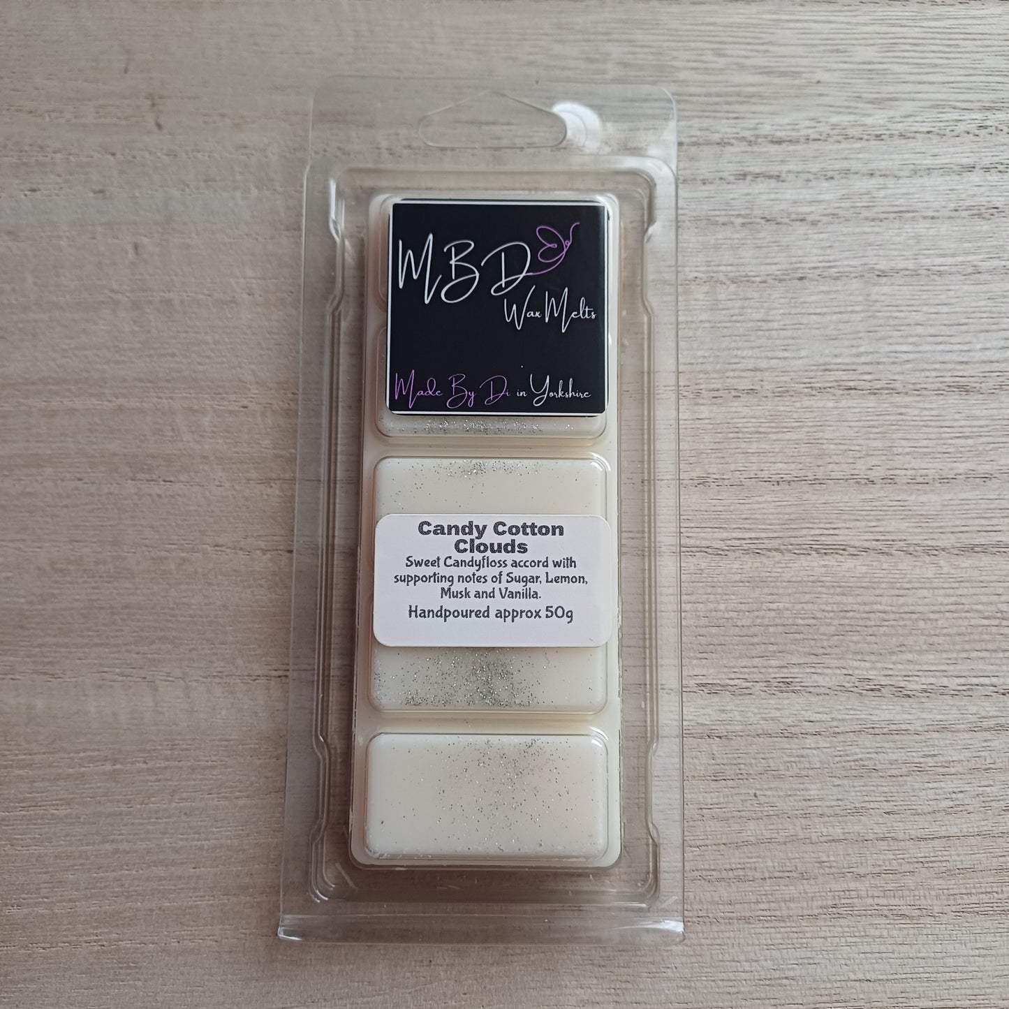 Packaged Candy Cotton Clouds Wax Melt Snap Bar on a wooden background