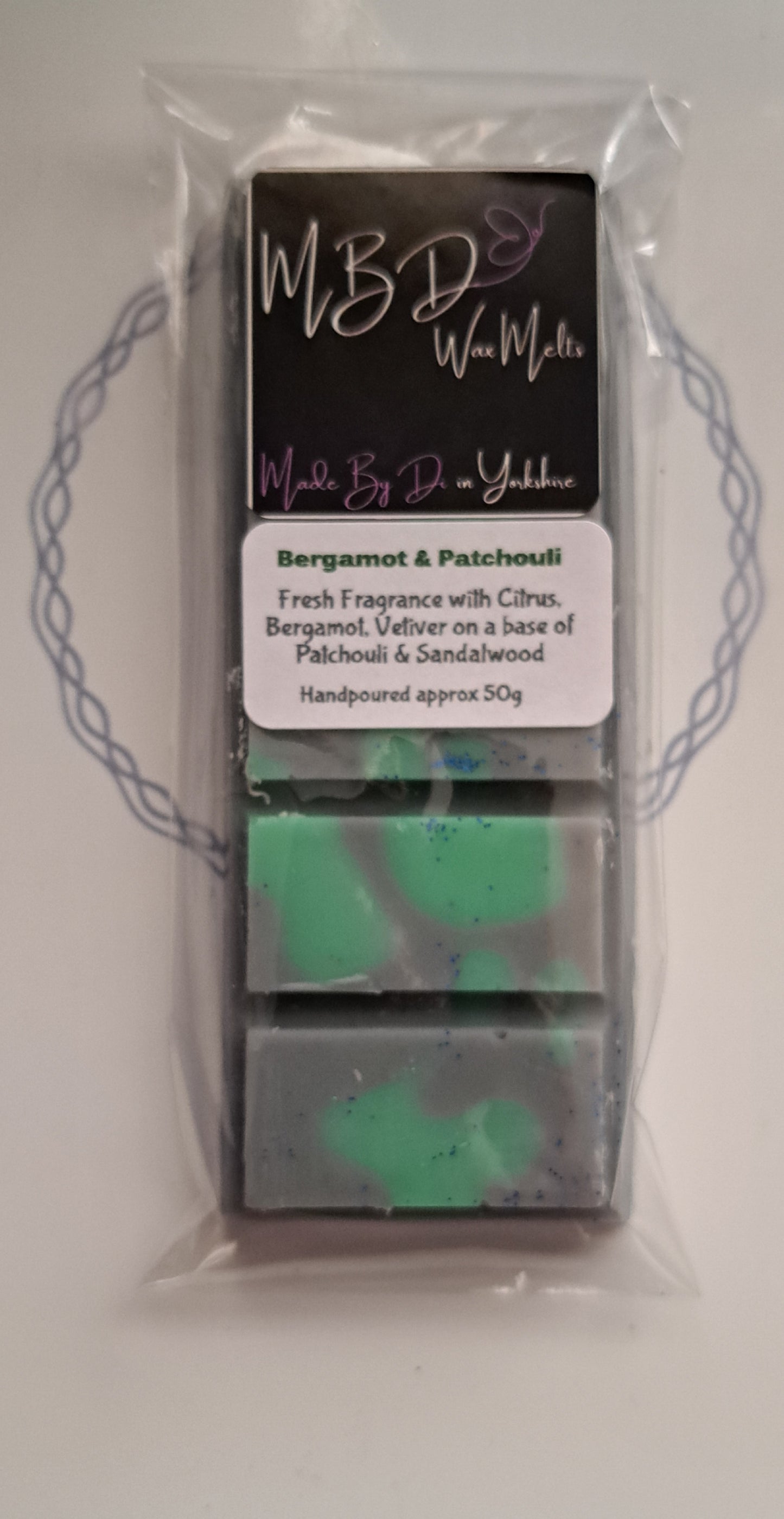 Black and Green Wax melt in packaging