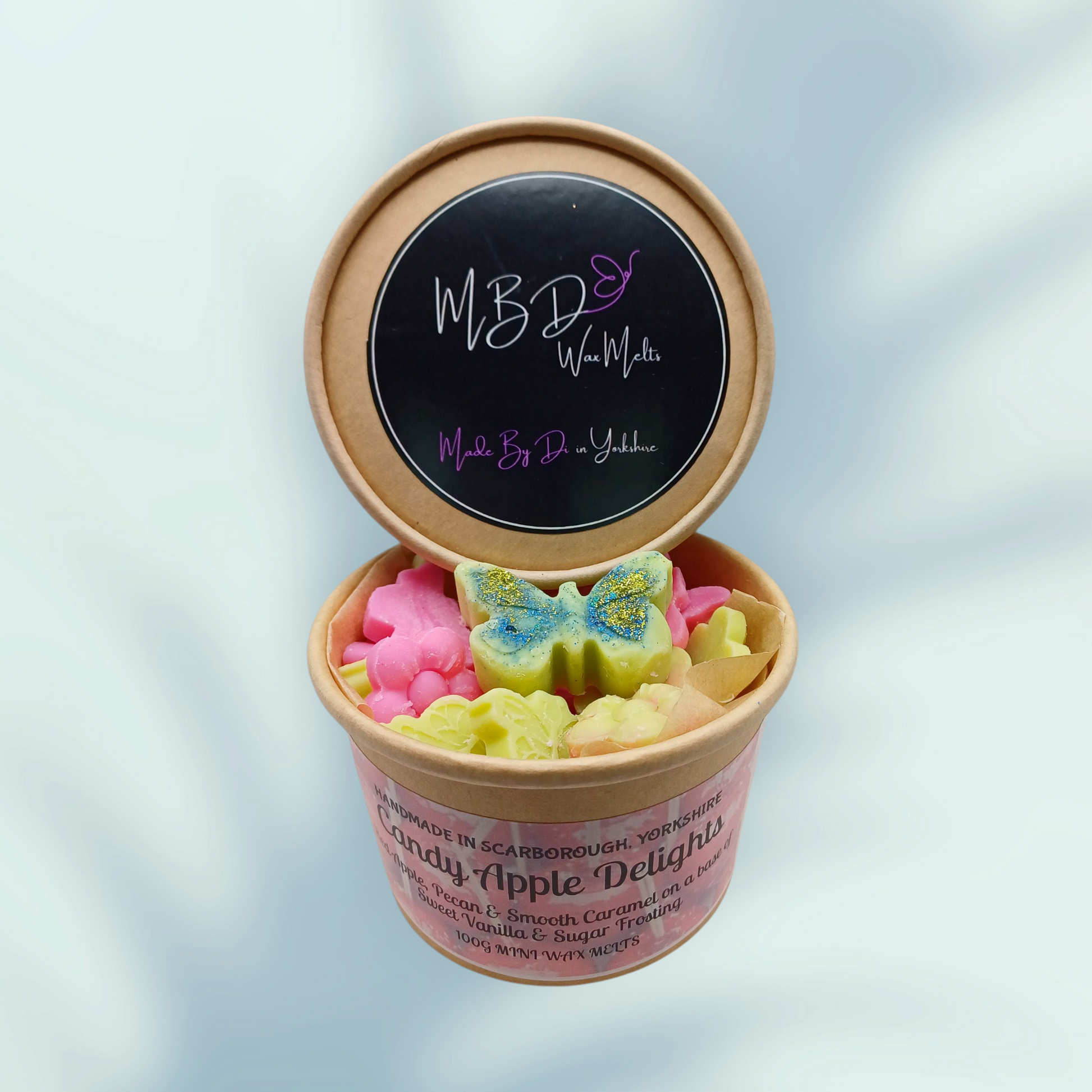 Container of mini wax melts from MBD Fragrance