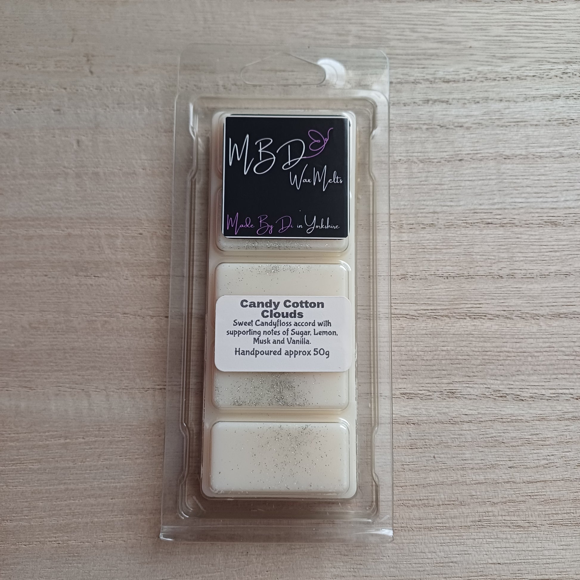 Packaged Candy Cotton Clouds Wax Melt Snap Bar on a wooden background