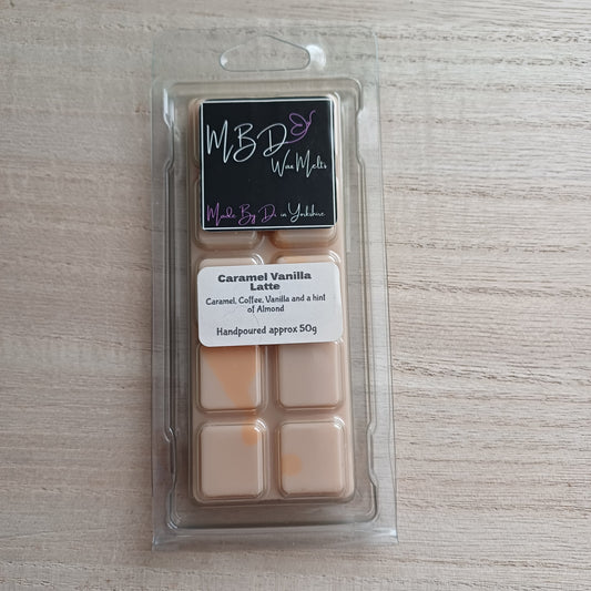Packaged Caramel Vanilla Latte wax Melt on a wooden background