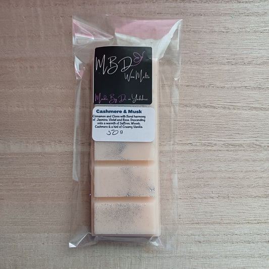 Packaged Wax melts on a wooden background.