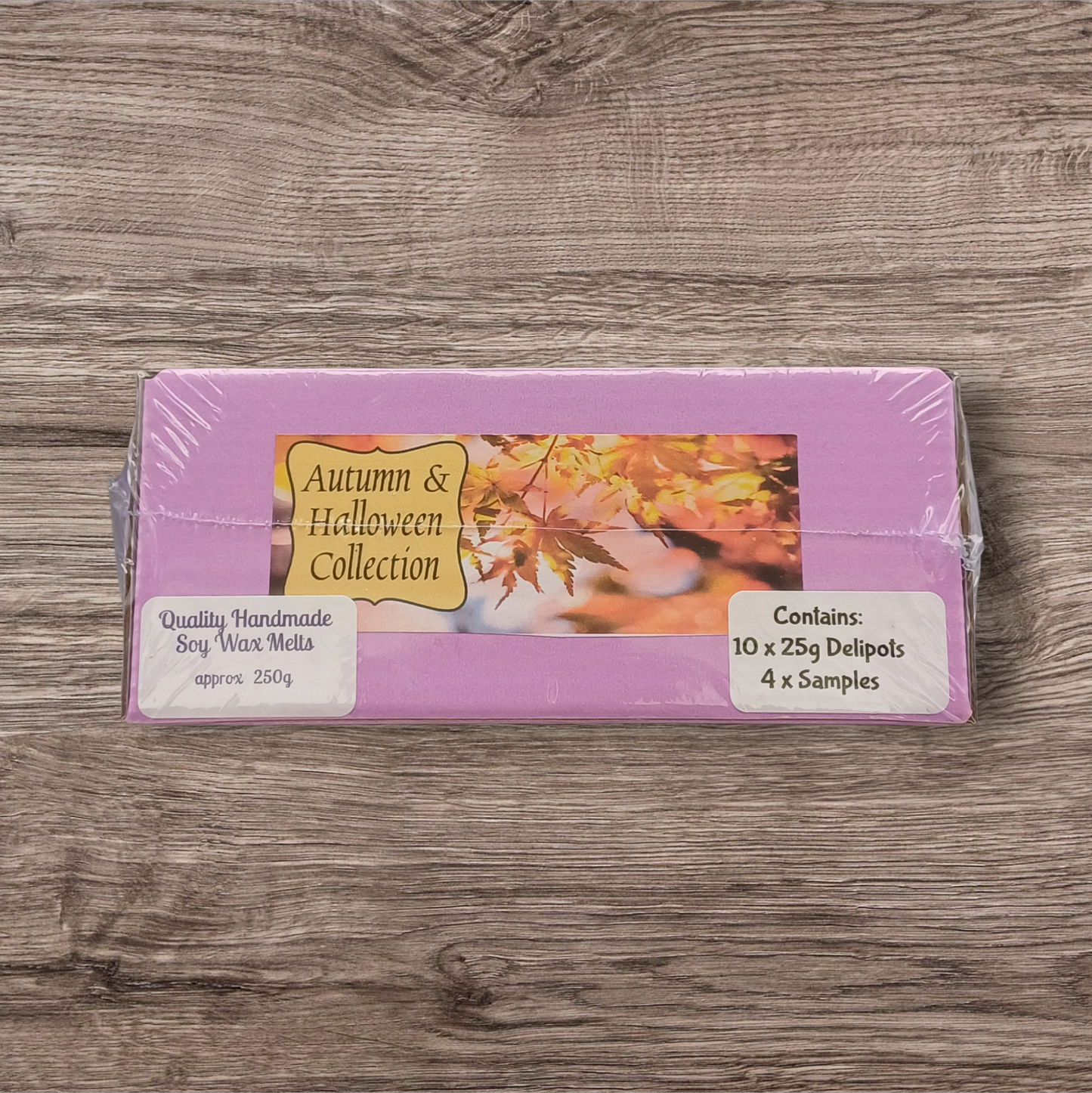 Pack of Autumn & Halloween Collection wax melts on a wooden surface