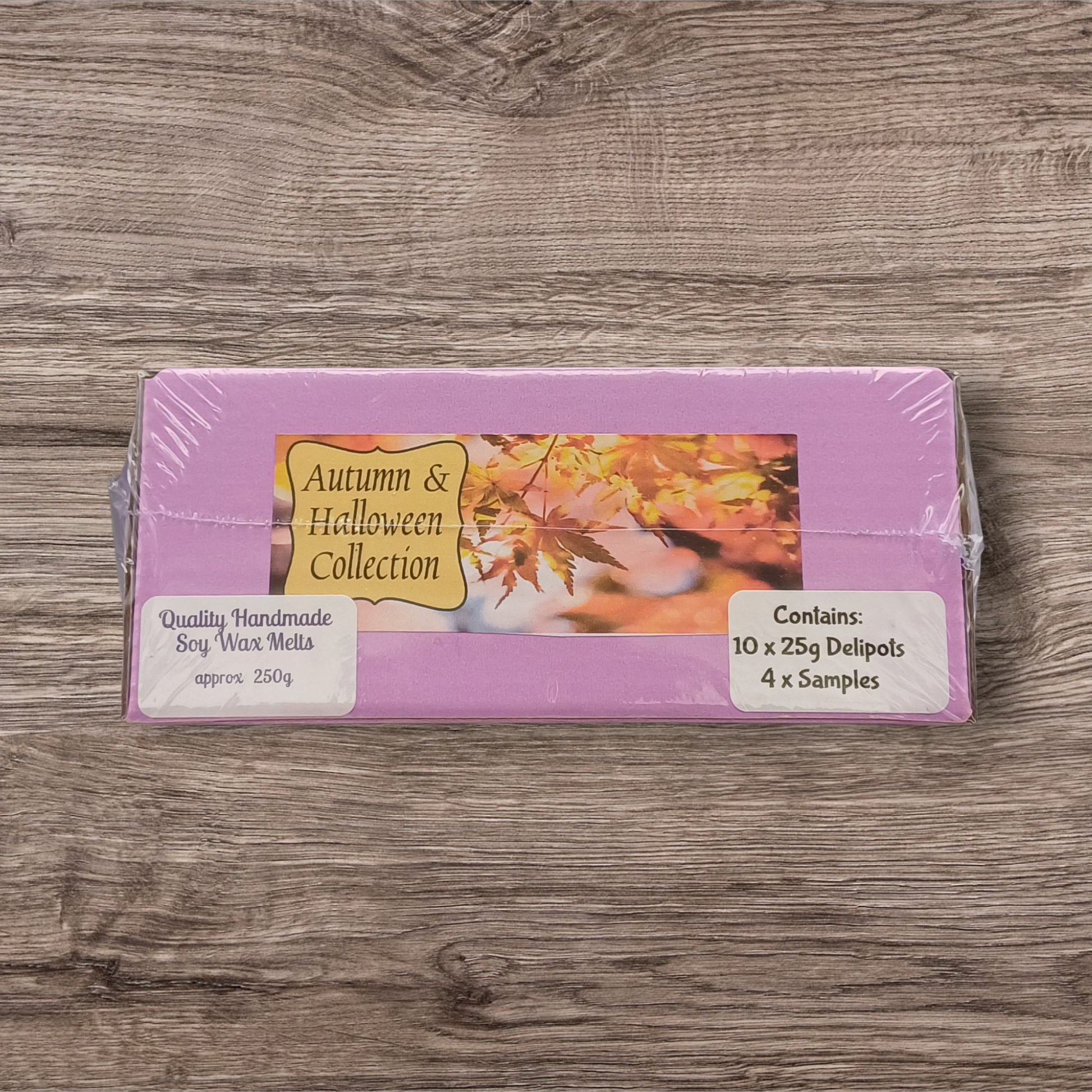 Pack of Autumn & Halloween Collection wax melts on a wooden surface