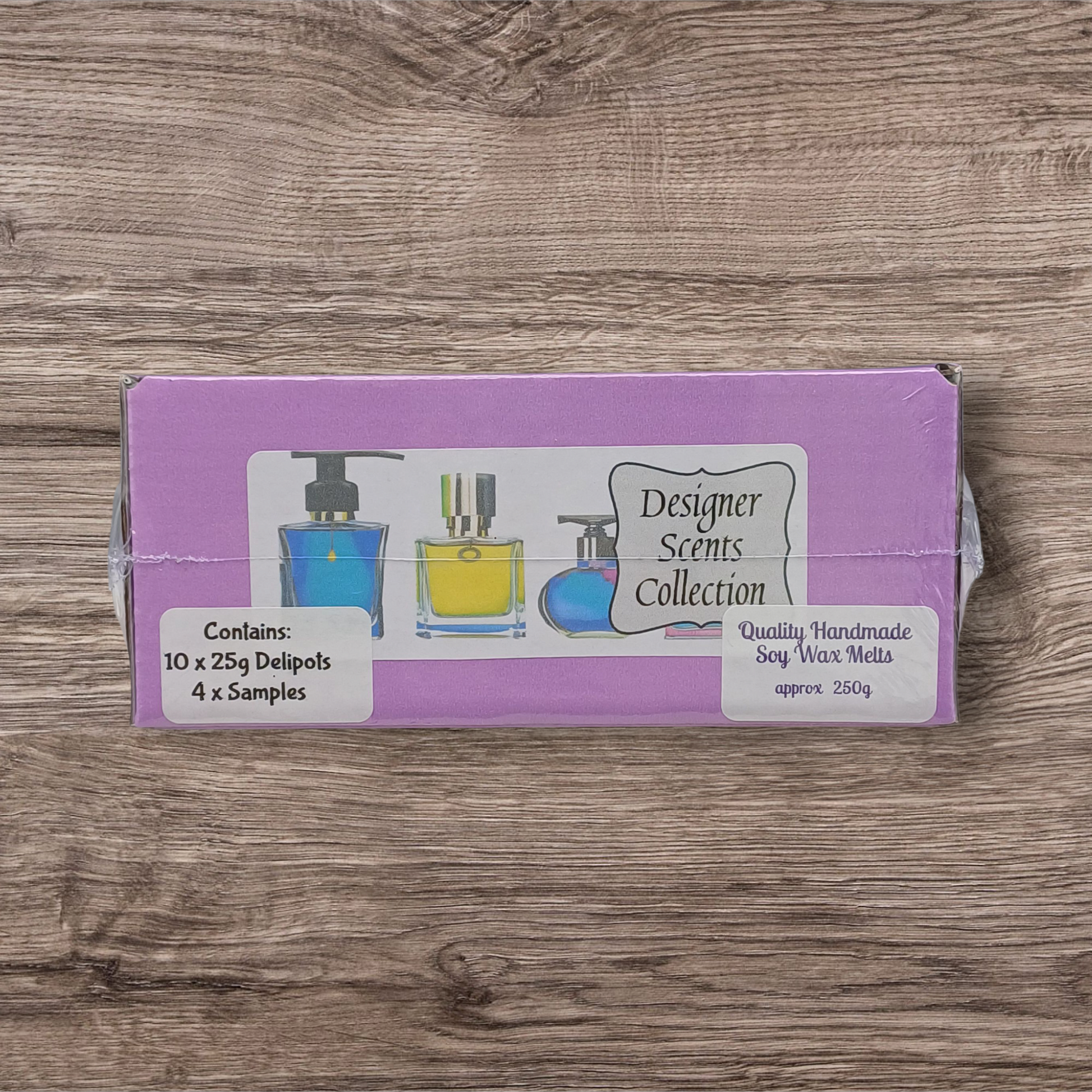 Purple packaging of Designer Scents Collection on a wooden surface