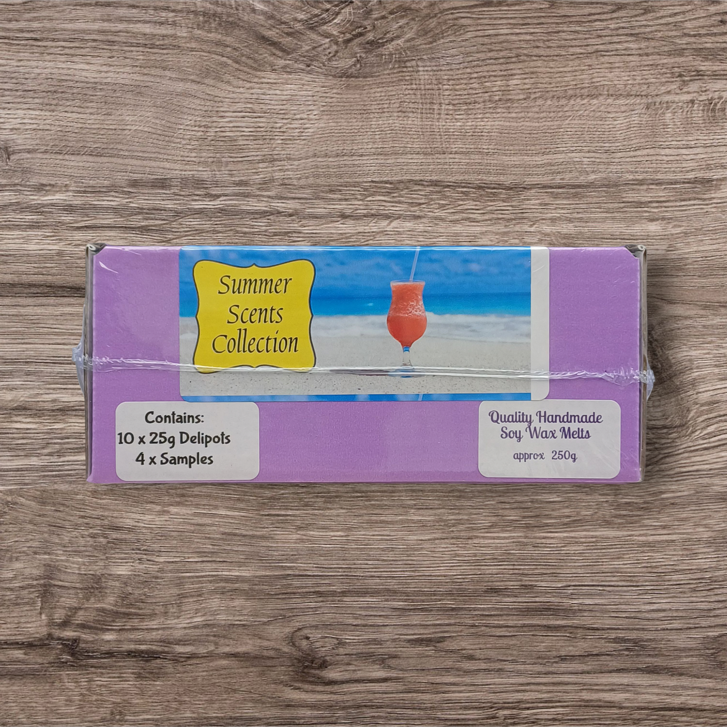 Pack of Summer Scents Collection soy wax melts on a wooden surface