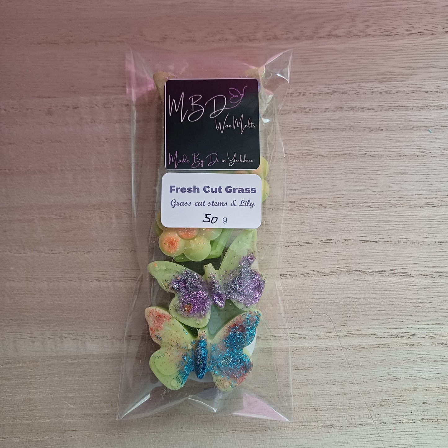 Packaged Decorative Wax Melts on a wooden surface