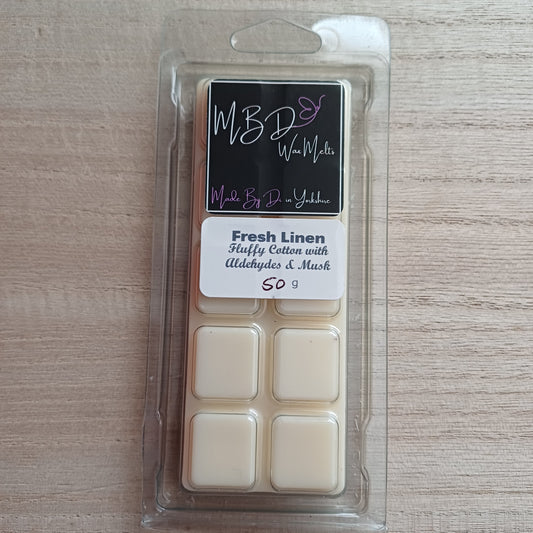 Packaged Wax Melts with MBD Branding on a wooden surface