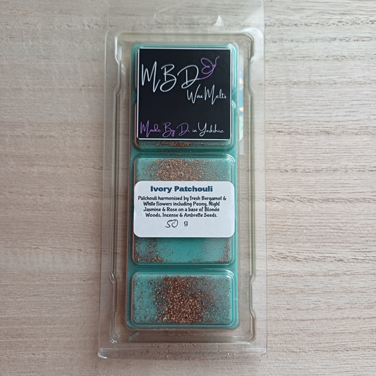 Packaged Wax Melts from MBD on a wooden surface