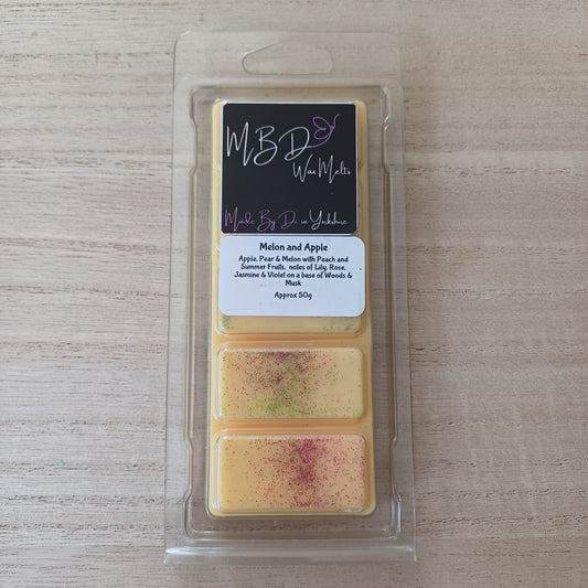 Wax Melt Bar in a clear package on a wooden surface