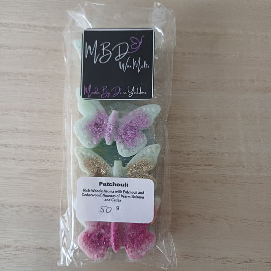 Packaged Decorative Shaped Wax Melts on a Wooden surface