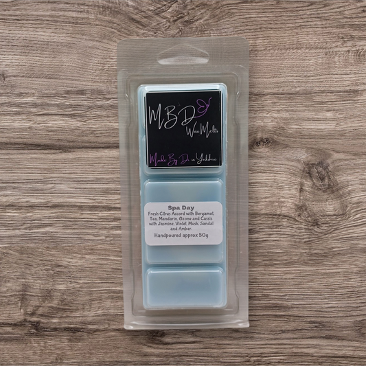 Packaged wax melts with a label on a wooden surface